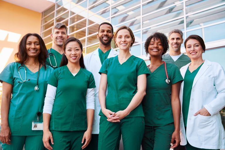 A diverse group of healthcare professionals standing together
